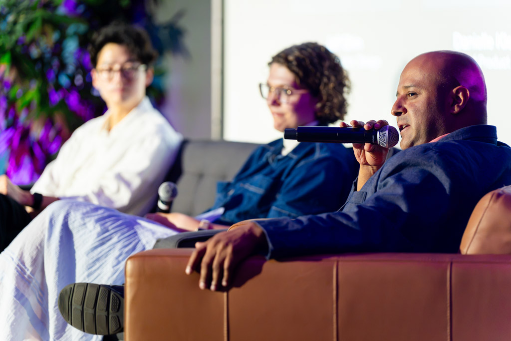 Jose speaking on the Leaders in Design panel, co-panelists beside him